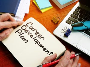Employee Career Development Plan written on notebook